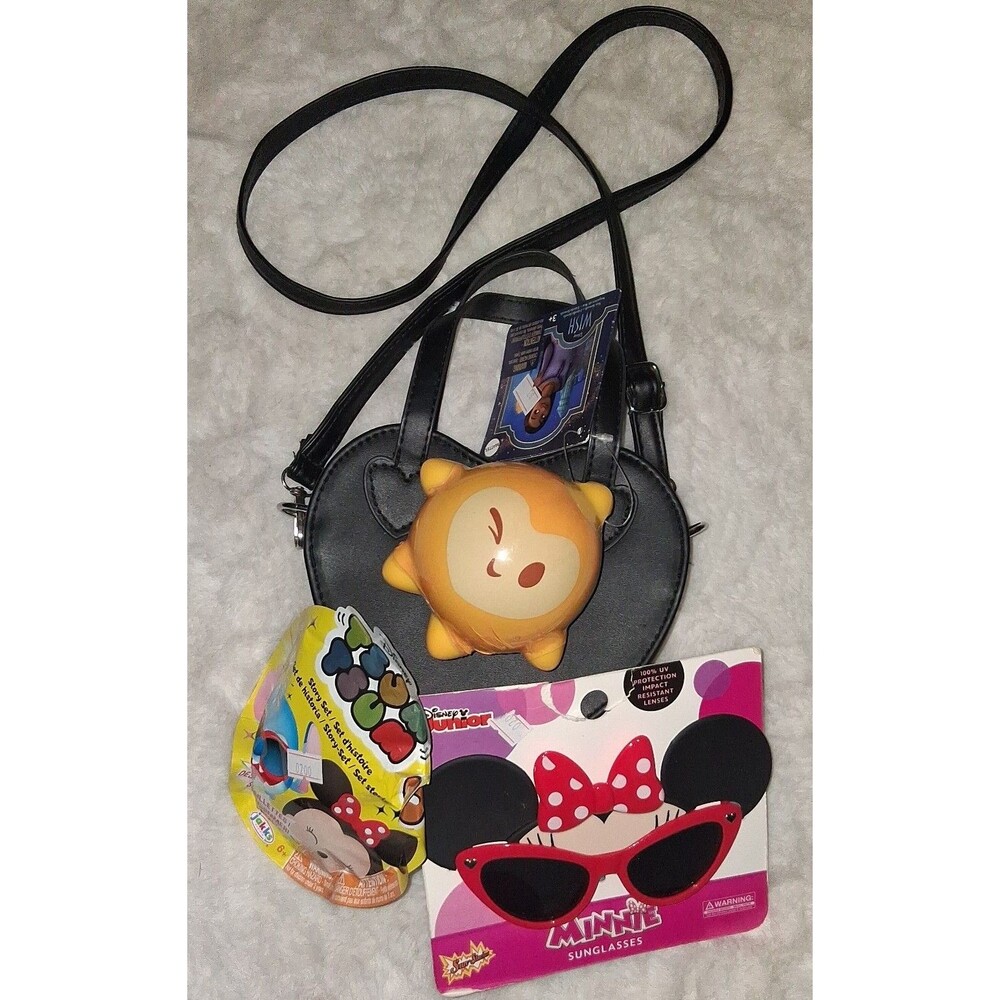 Heart shaped crossbody bag with Minnie Mouse sunglasses and squishy toy